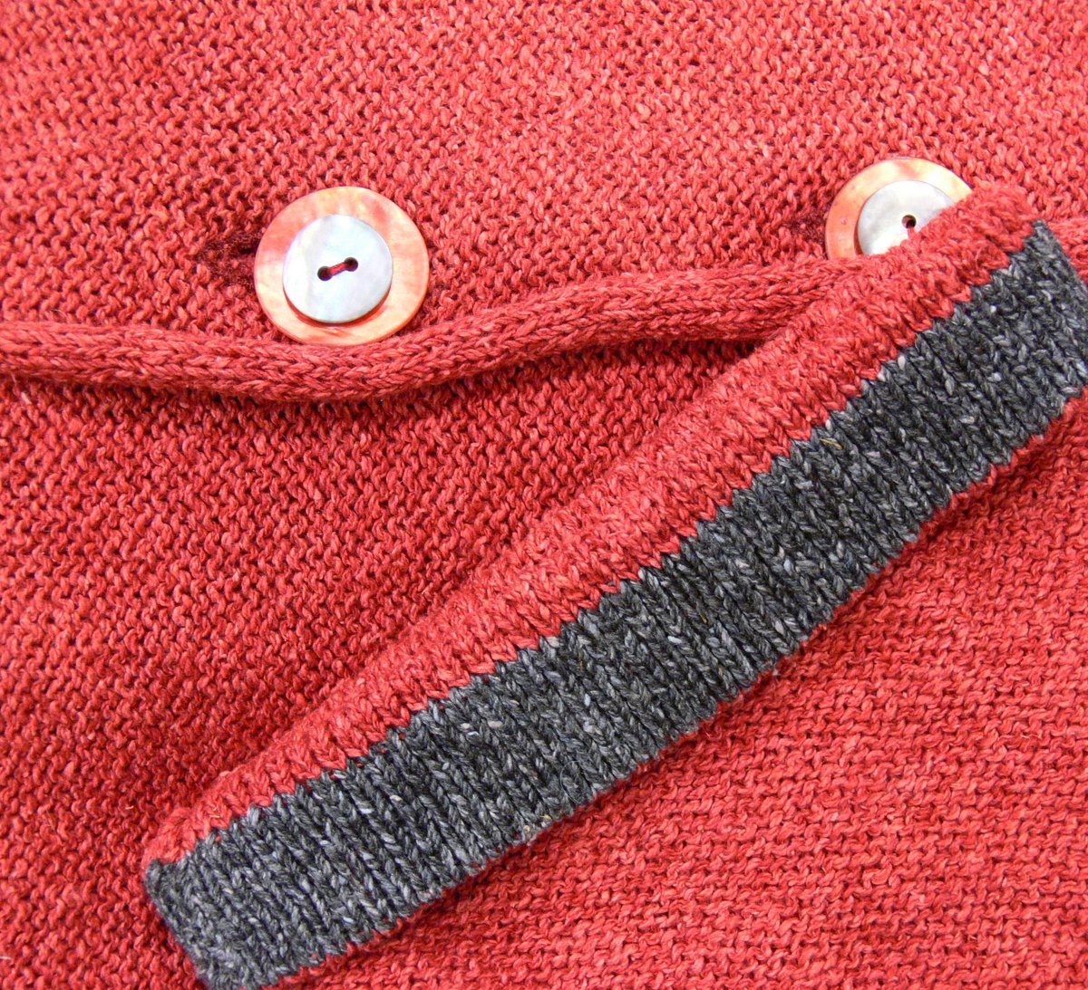 Detail from Carousel Medium Jacket in poppy/indigo, knitted in silk/lambswool yarn, desgned and made in Orkney