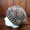 Contemporary fair isle beanie hand knitted in Orkney in pure Shetland wool.